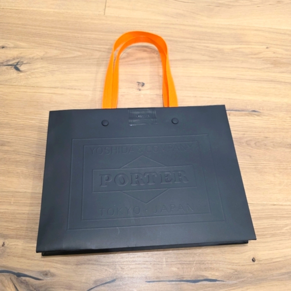 Porter Yoshida Black and Orange Paper Bag
